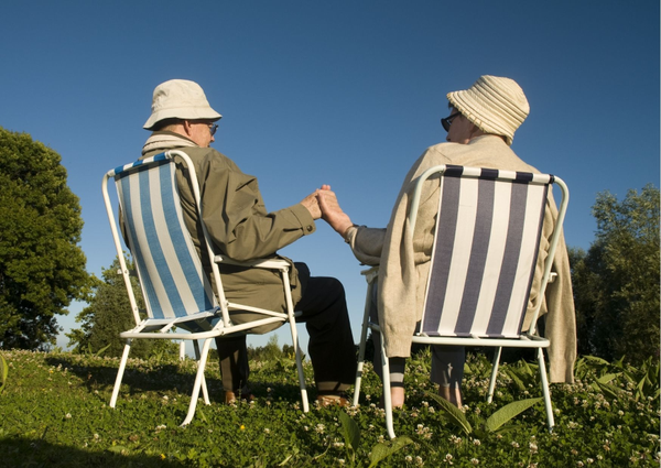 Couple relaxing outdoors after moving to a 55 and up community in the Central Valley